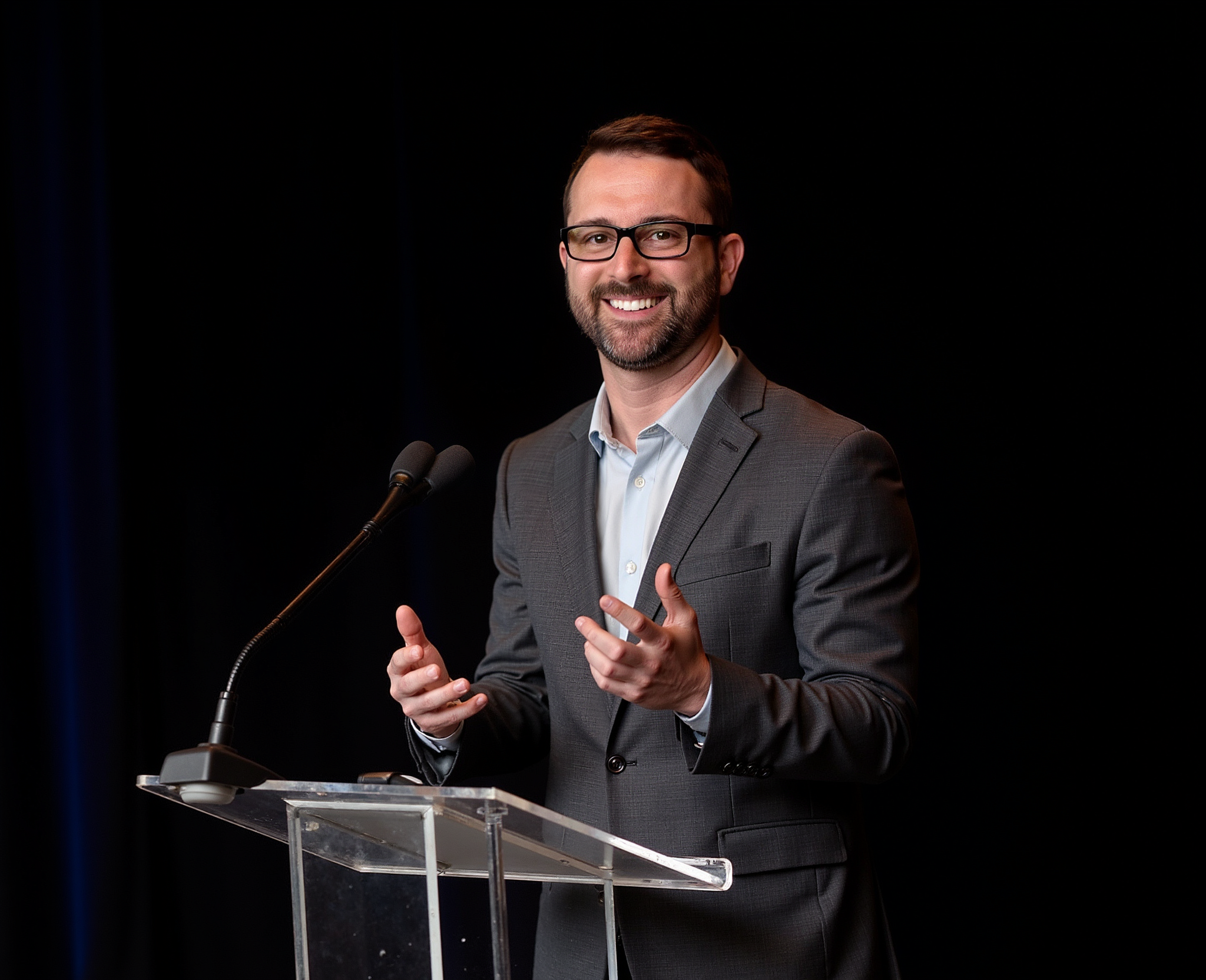Dr. Michael Morse presenting at a podium
